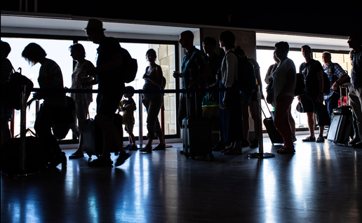People in a queue for passport control at an airport