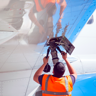 Man putting fuel into an aircraft