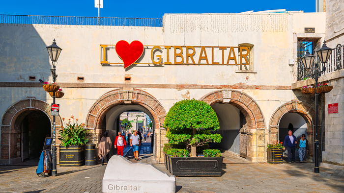 An arch in the street with an I love Gibraltar sign above it