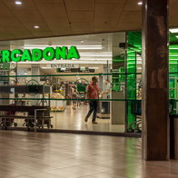 Mercadona supermarket entrance in Spain with store open and customers inside during shopping hours