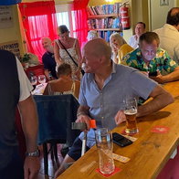 Guests enjoying drinks and events at The Sussex bar