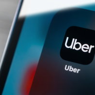 Uber app icon on smartphone screen as new hotel booking feature is introduced