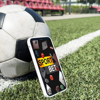 Live in-play betting app on a mobile phone screen on a football pitch with a football