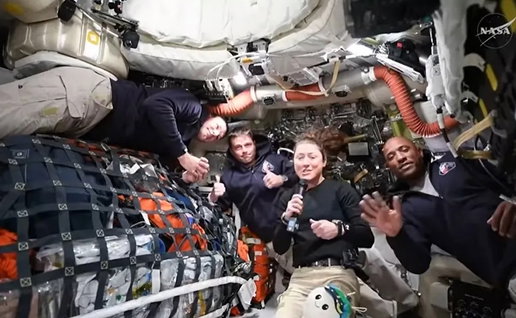 The astronauts inside the Orion.