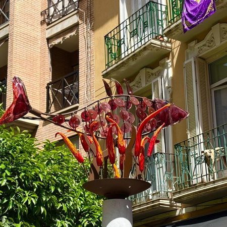 Person filling out mortgage application form with documents and calculator