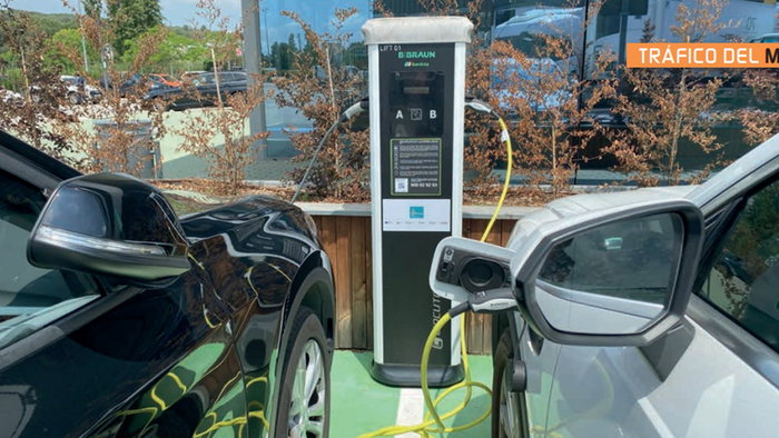 Electric cars charging at a public station in Spain as demand for affordable EVs rises