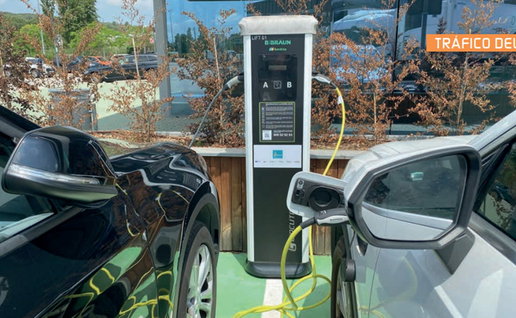 Electric cars charging at a public station in Spain as demand for affordable EVs rises