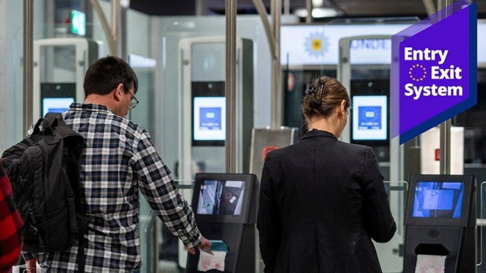 Travellers using automated border control gates under the EU Entry Exit System at an airport