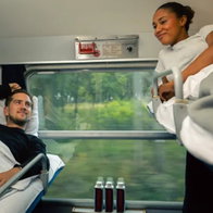 Passengers relaxing in a sleeper cabin on a night train