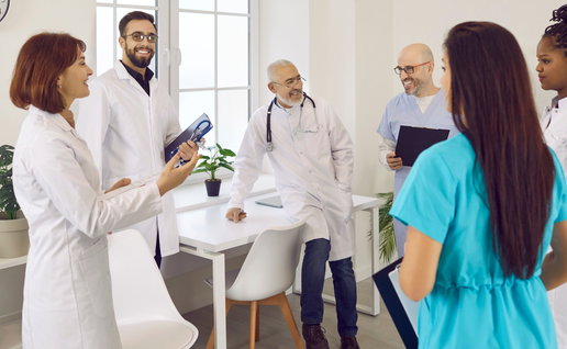 Group of healthcare professionals in a clinic discussing work in Spain