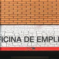 Spanish employment office sign on building facade