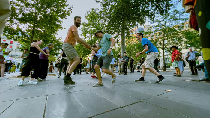 People dancing in the street.