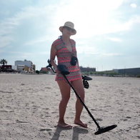 Woman filming a YouTube video on a Spanish beach