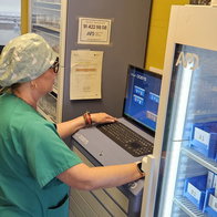 Healthcare worker preparing medication for patient at Elche General Hospital