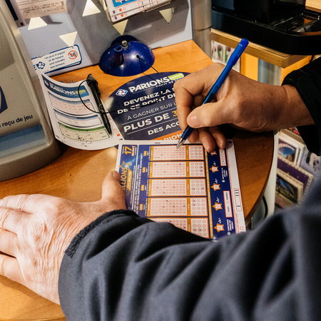 Close-up of a Euromillions ticket at a Spanish lottery shop counter
