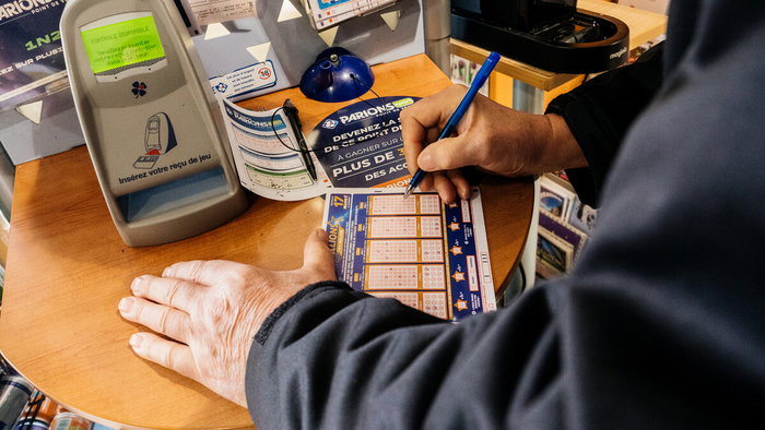 Close-up of a Euromillions ticket at a Spanish lottery shop counter