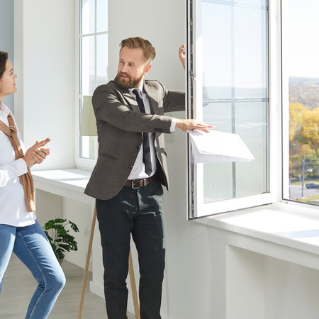 Couple viewing a property with real estate agent in Spain