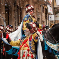 Participants in elaborate historical costumes during Moros y Cristianos parade in Orihuela