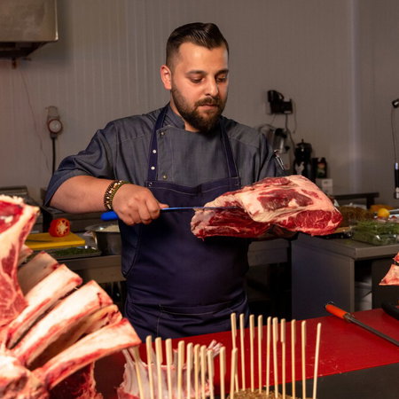 Shopper selecting a mix of meat, dairy and plant-based products in a European supermarket