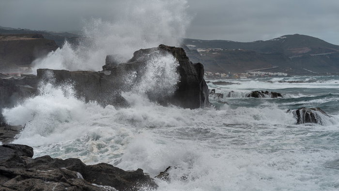 Large waves crashing against rocky northern coast of Canary Islands during storm