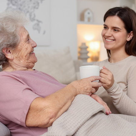 Elderly person laying at home as Spain introduces support for family-based care