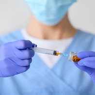 Healthcare professional preparing HIV prevention injection in clinic setting