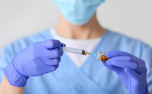 Healthcare professional preparing HIV prevention injection in clinic setting