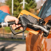 Driver refuelling car at a petrol station in Spain during normal operations after strike cancellation