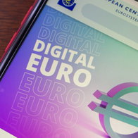 Smartphone displaying euro symbol representing digital euro payments