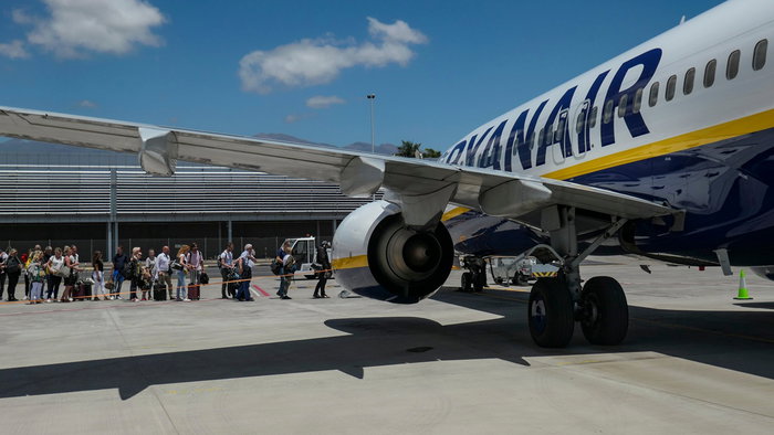 Passengers boarding a Ryanair plane as airline warns of delays from new border checks