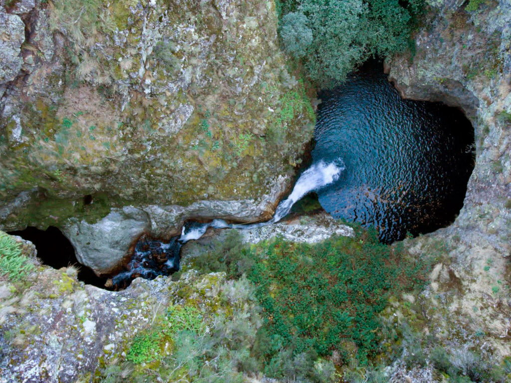 Aerial view of a natural rock pool in a river gorge in San Facundo, León, Spain