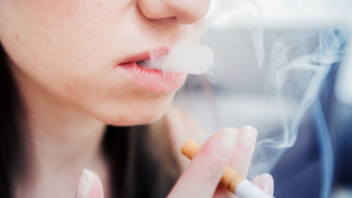 Young woman smoking a cigarette