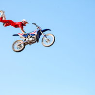 Freestyle motorcross motorcyclist caught in midair at festival in East Texas