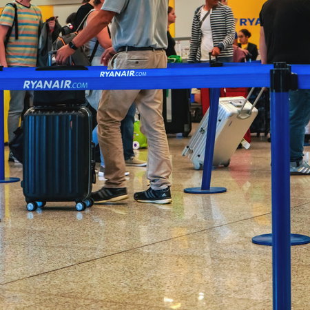 Passengers queuing at a Ryanair check-in