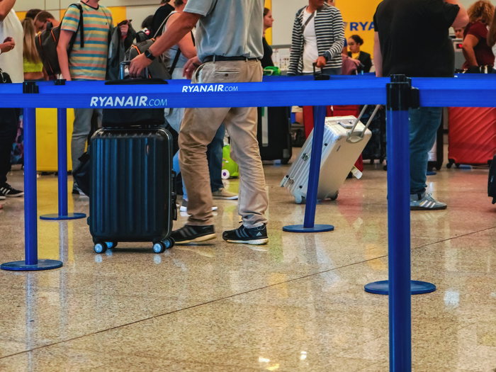 Passengers queuing at a Ryanair check-in