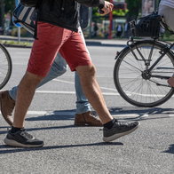 Walking and cycling across a pedestrian road