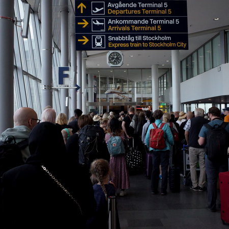 Passengers queuing to board an airplane