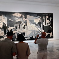 Visitors in front of Pablo Picasso painting Guernica