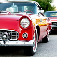 Vintage cars on display at classic automotive exhibition.