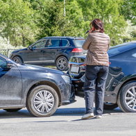 Woman involved in a car collision on the phone
