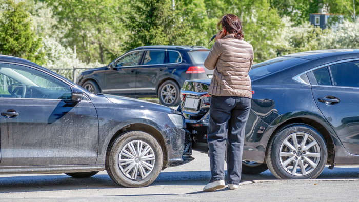 Woman involved in a car collision on the phone