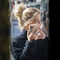 Woman talking on phone and smoking
