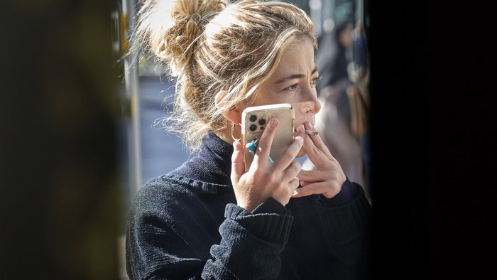 Woman talking on phone and smoking