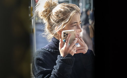 Woman talking on phone and smoking