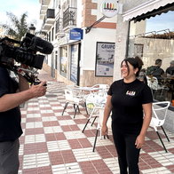 Stacey being quizzed on camera.