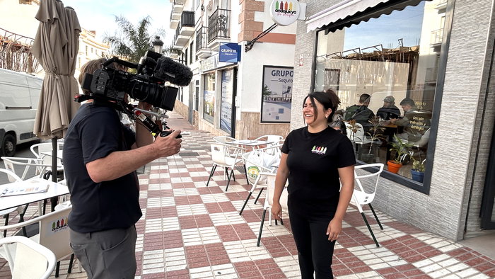 Stacey being quizzed on camera.