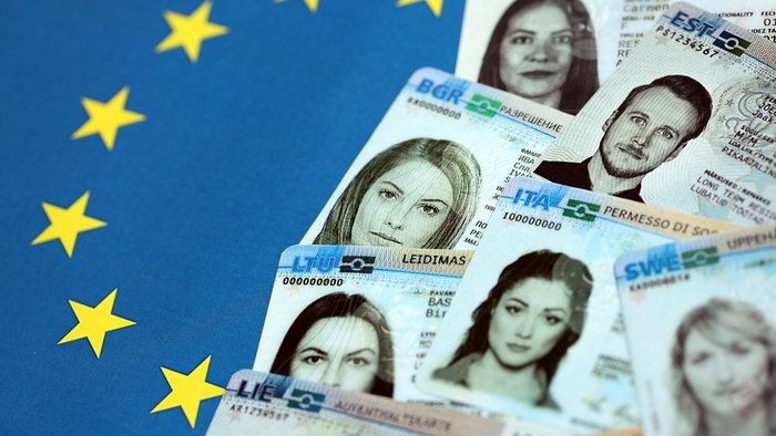 European residence permits displayed on an EU flag background