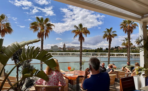 People sitting on a sunny restaurant terrace in Spain as new heatwave rules could affect outdoor service this summer