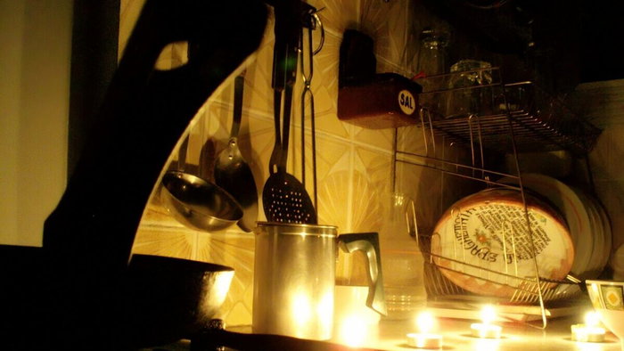 kitchen illuminated by tea candles