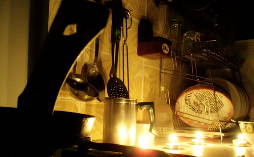 kitchen illuminated by tea candles